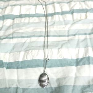 Silver color pendant with a silver color chain
